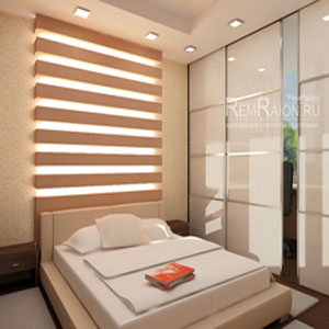 Дизайн спальни-кабинета с декоративной стеной за кроватью с подсветкой